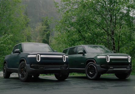 Rivian's second generation of electric vehicles, the R1T pick-up truck and the R1S SUV parked side-by-side