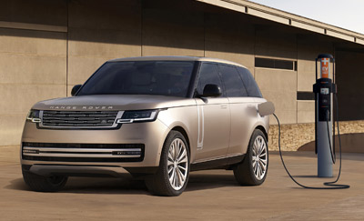 A Range Rover PHEV plugged into a charging station