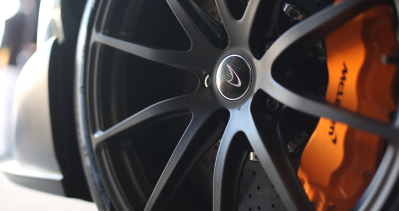 A closeup of a McLaren electric sedan’s wheel
