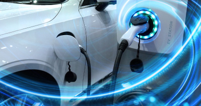 A close-up shot of a charging cable attached to a Subaru electric vehicle’s charging port