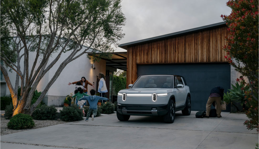 A Rivian R2 Electric SUV parked in a driveway
